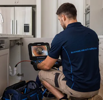 Clearing a blocked sink at a Camden South property